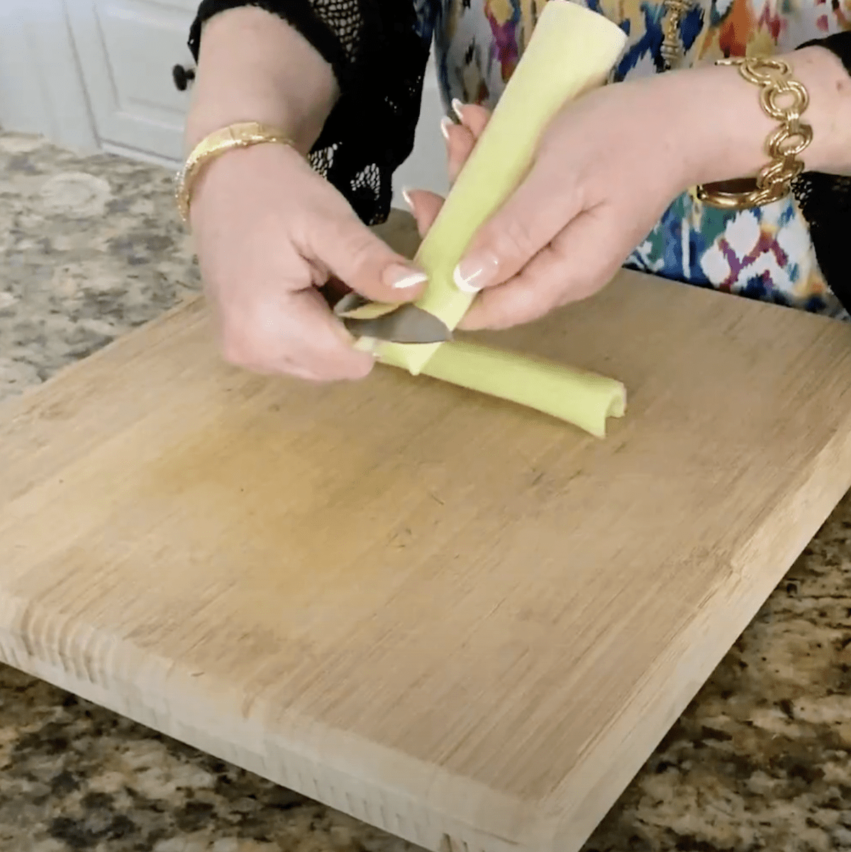peeling end celery with knife