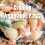 creamy veggie pasta in spoon