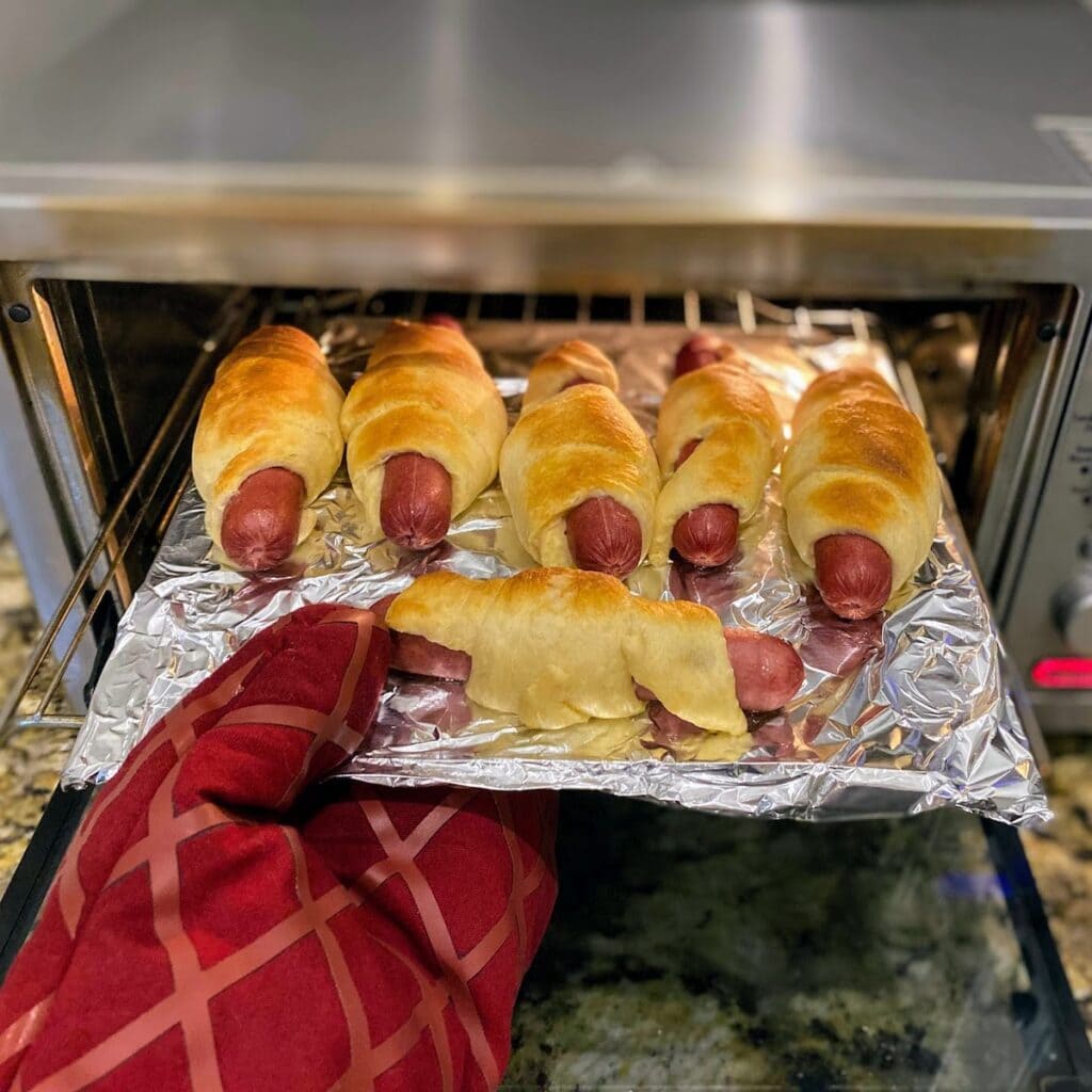 hot dogs going into toaster oven