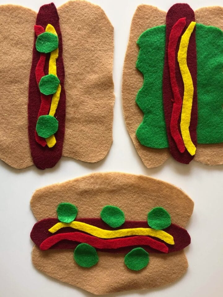 three felt hot dogs
