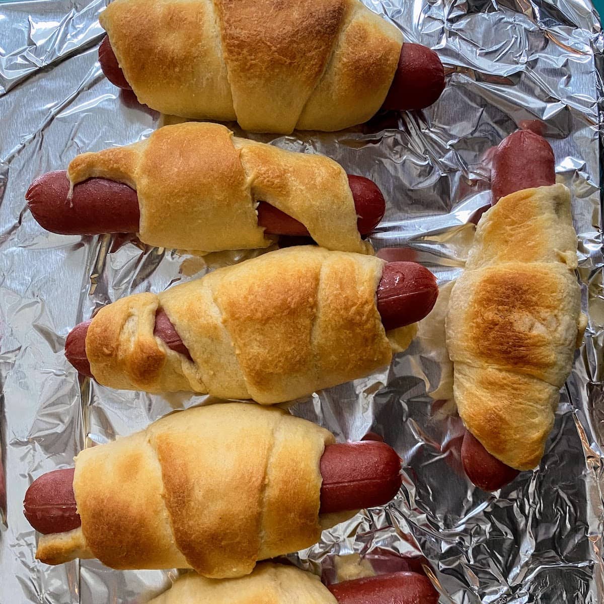 cooked hot dogs in crescents one baking sheet