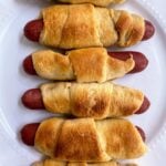 hot dogs in crescent rolls on plate