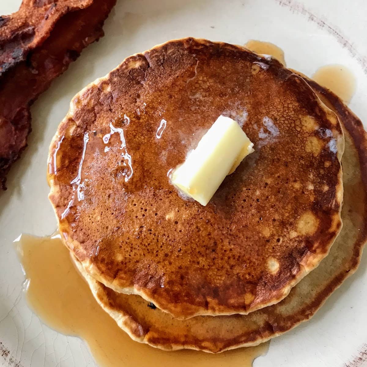 cinnamon pancakes with bacon on the side