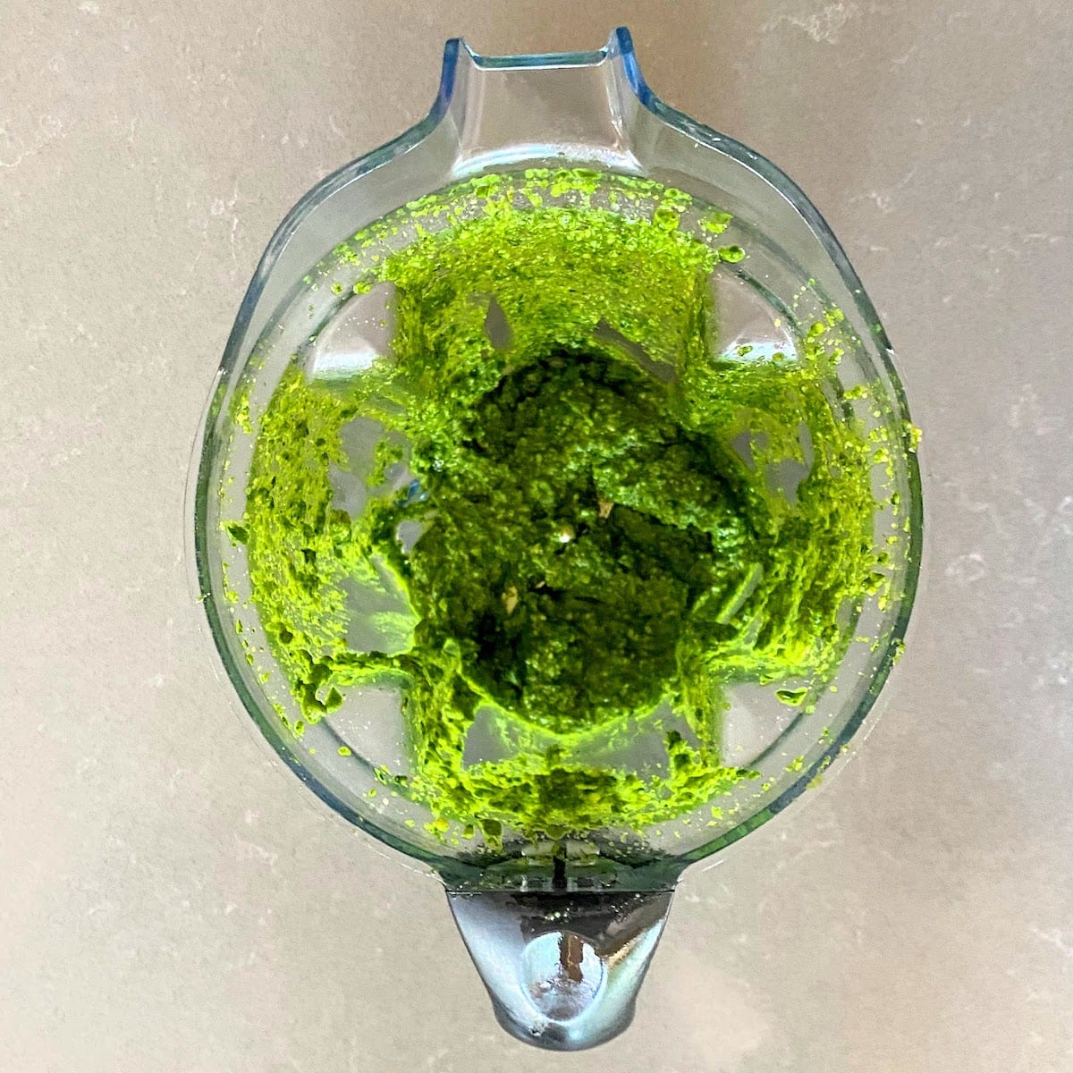blended spinach pesto in vitamix container