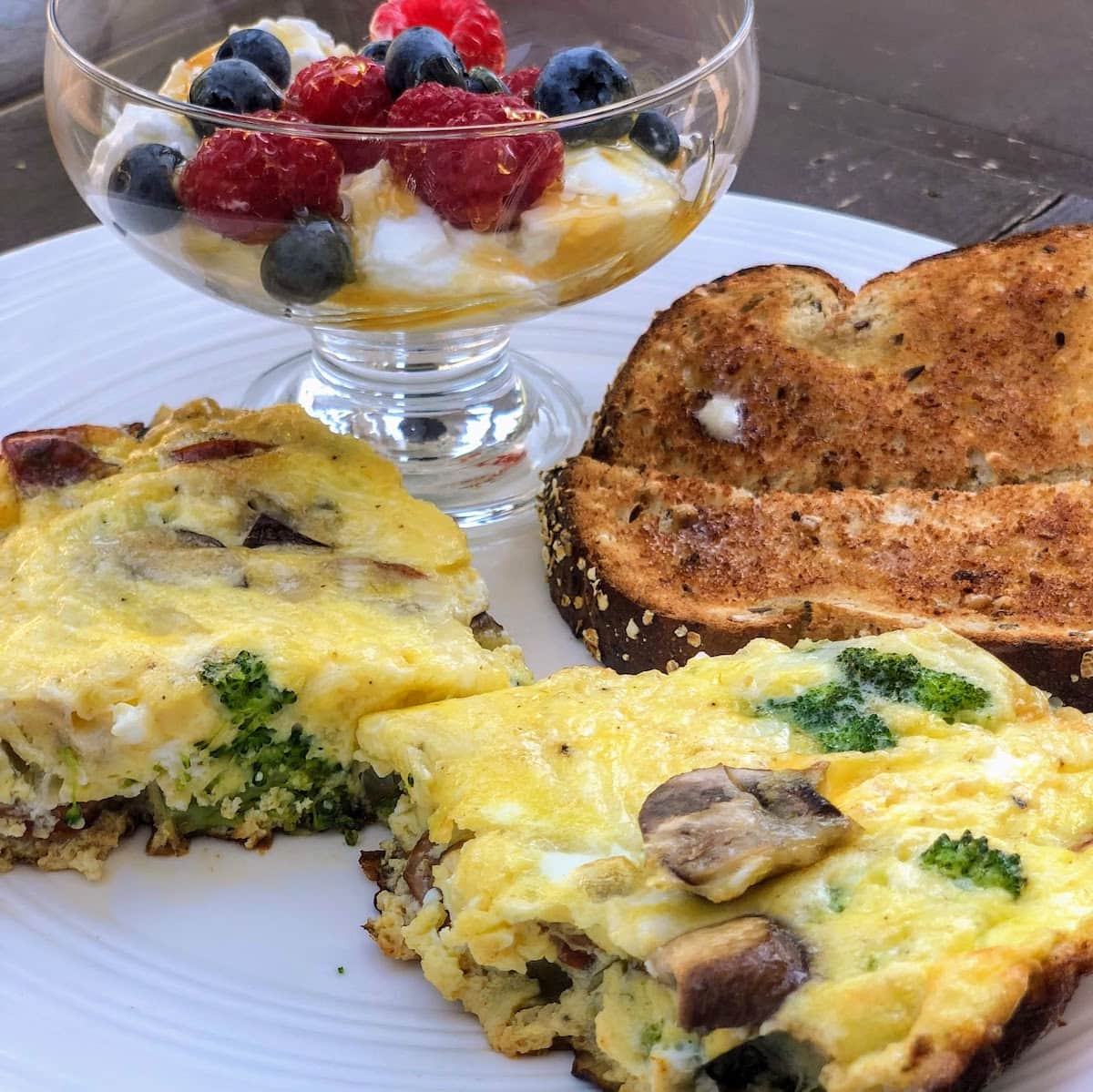 slices of frittata with yogurt and fruit side dish