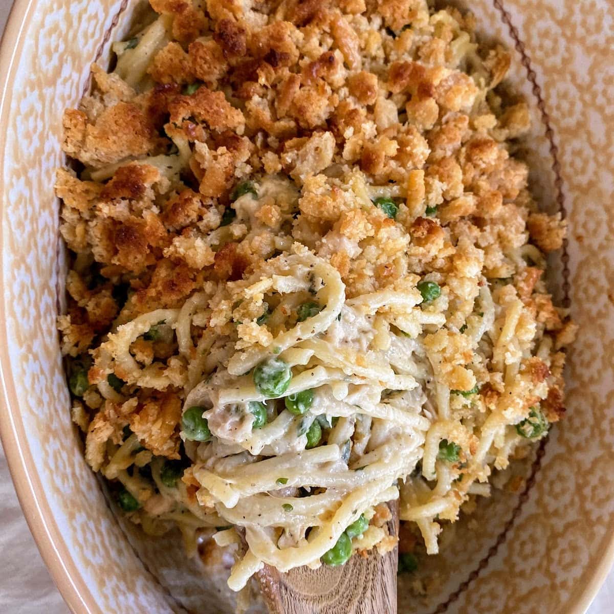 spaghetti tuna casserole topped with crushed crackers