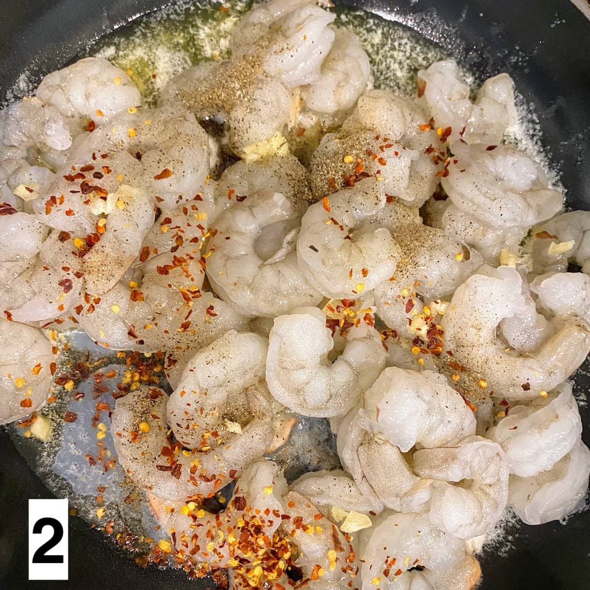 seasoned raw shrimp in pan