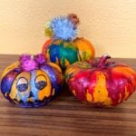 three colorful pumpkins