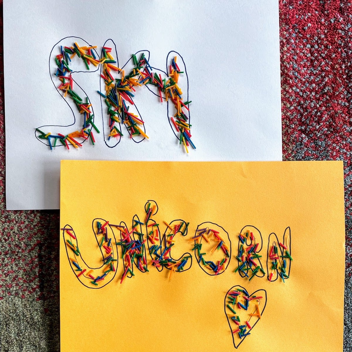 words unicorn and sky with rainbow pasta sprinkled on top 