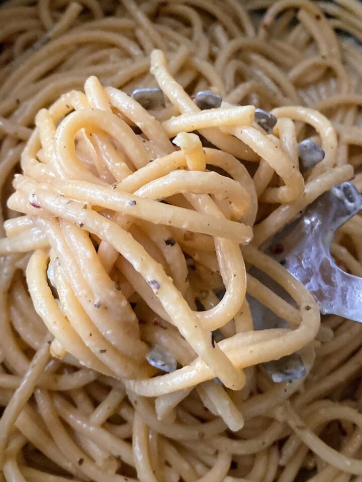 close up of lemon garlic pasta in pot