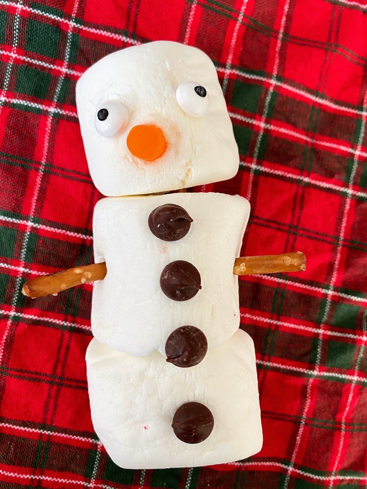 one marshmallow snowman with four buttons