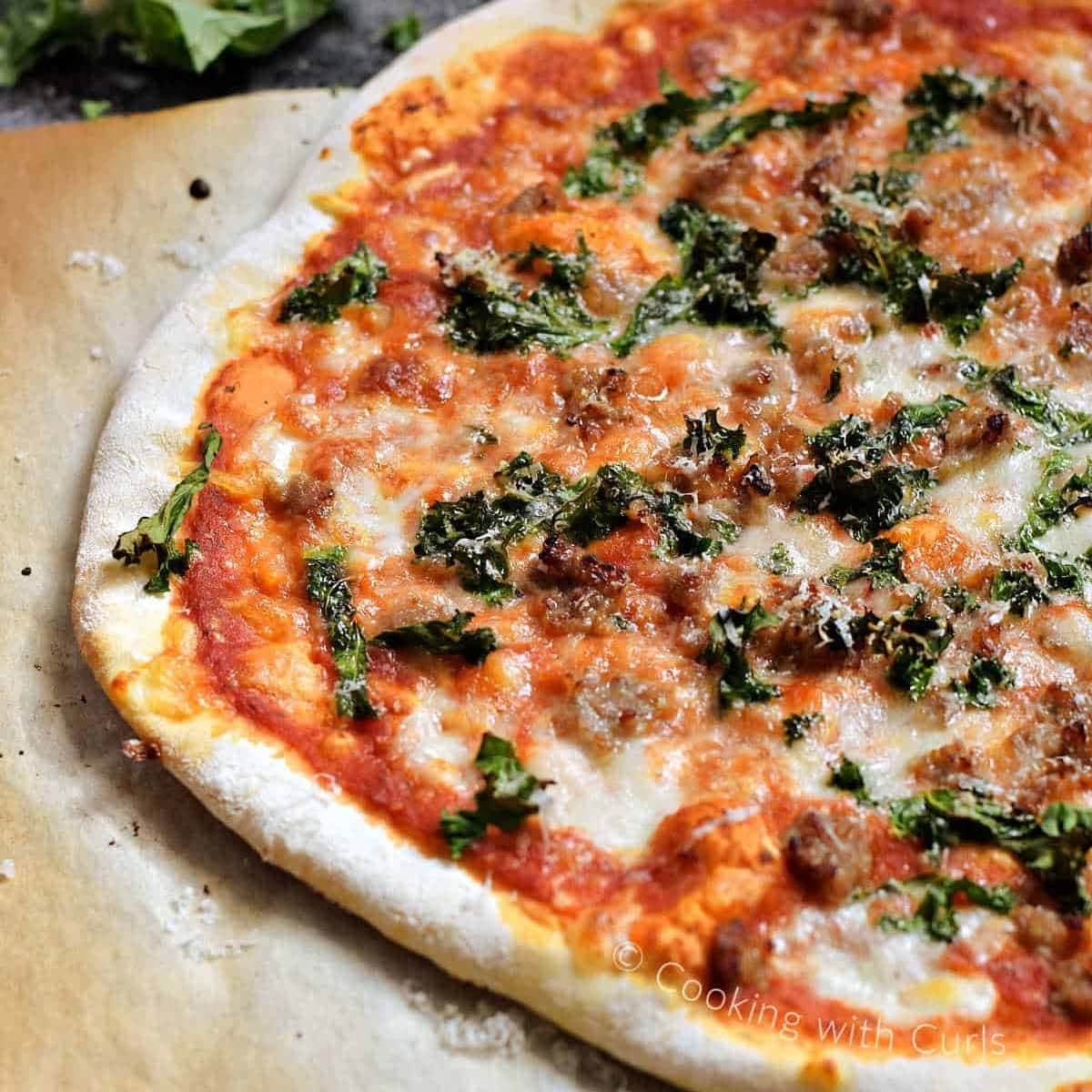 pizza with sausage and kale 