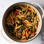 penne in cajun sauce with sausage and veggies in baking pan