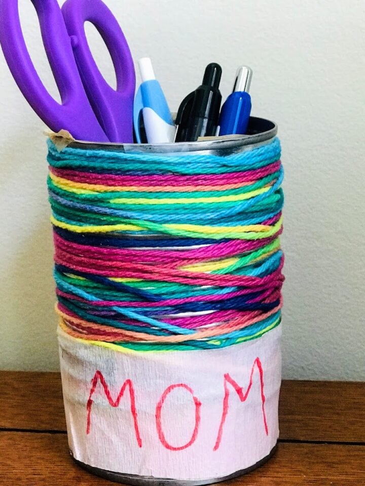 tin can pencil holder with scissors and pens