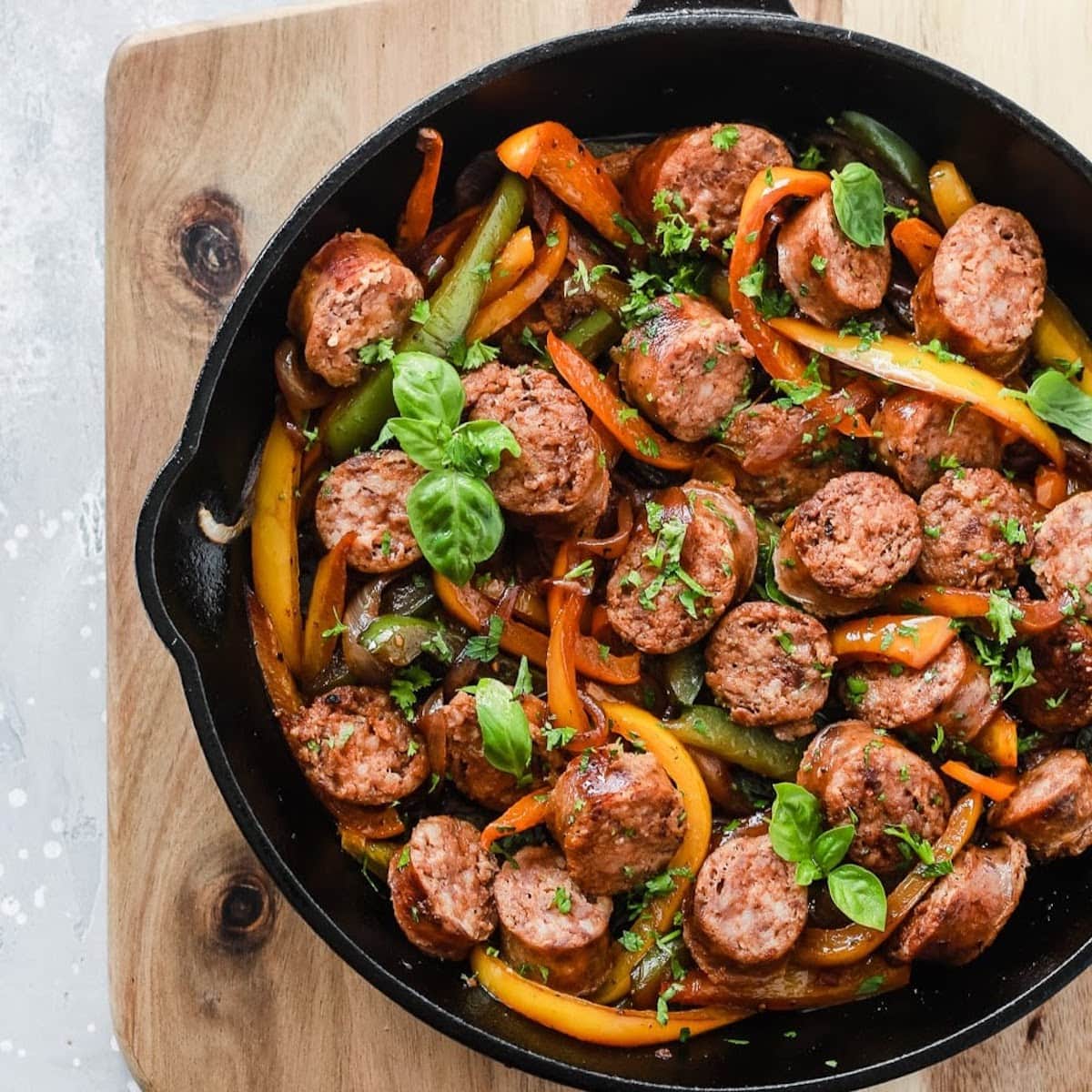 sausage onions peppers in skillet