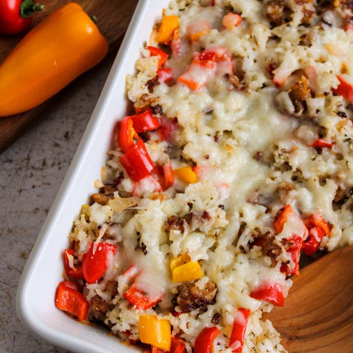 stuffed pepper casserole with bell peppers and sausage in casserole dish