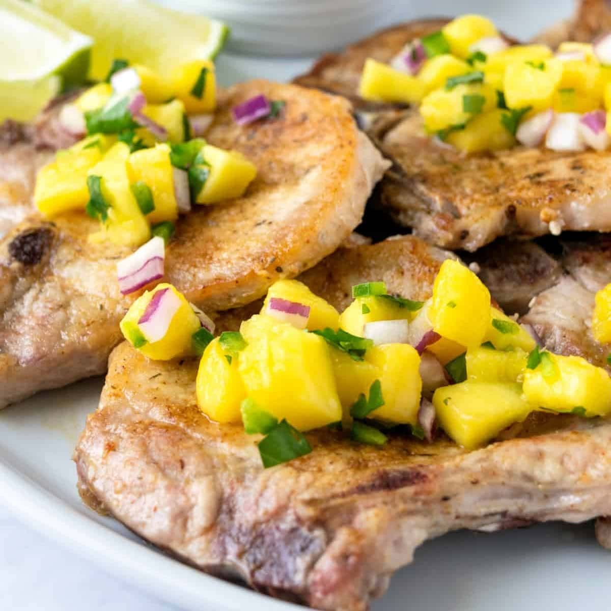 pork chops topped with mango sauce