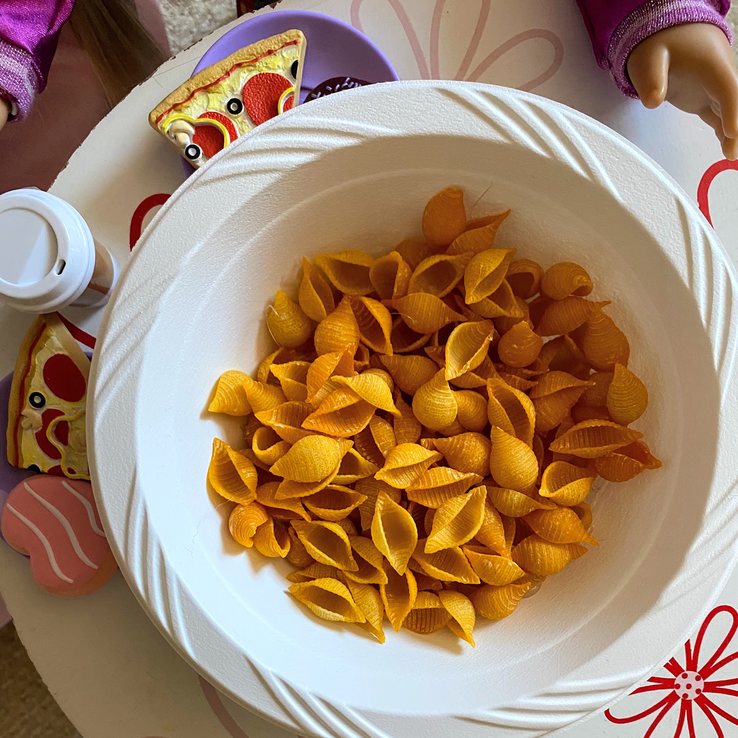 fake mac and cheese in bowl on doll's table