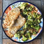 two pork chops with broccoli on plate