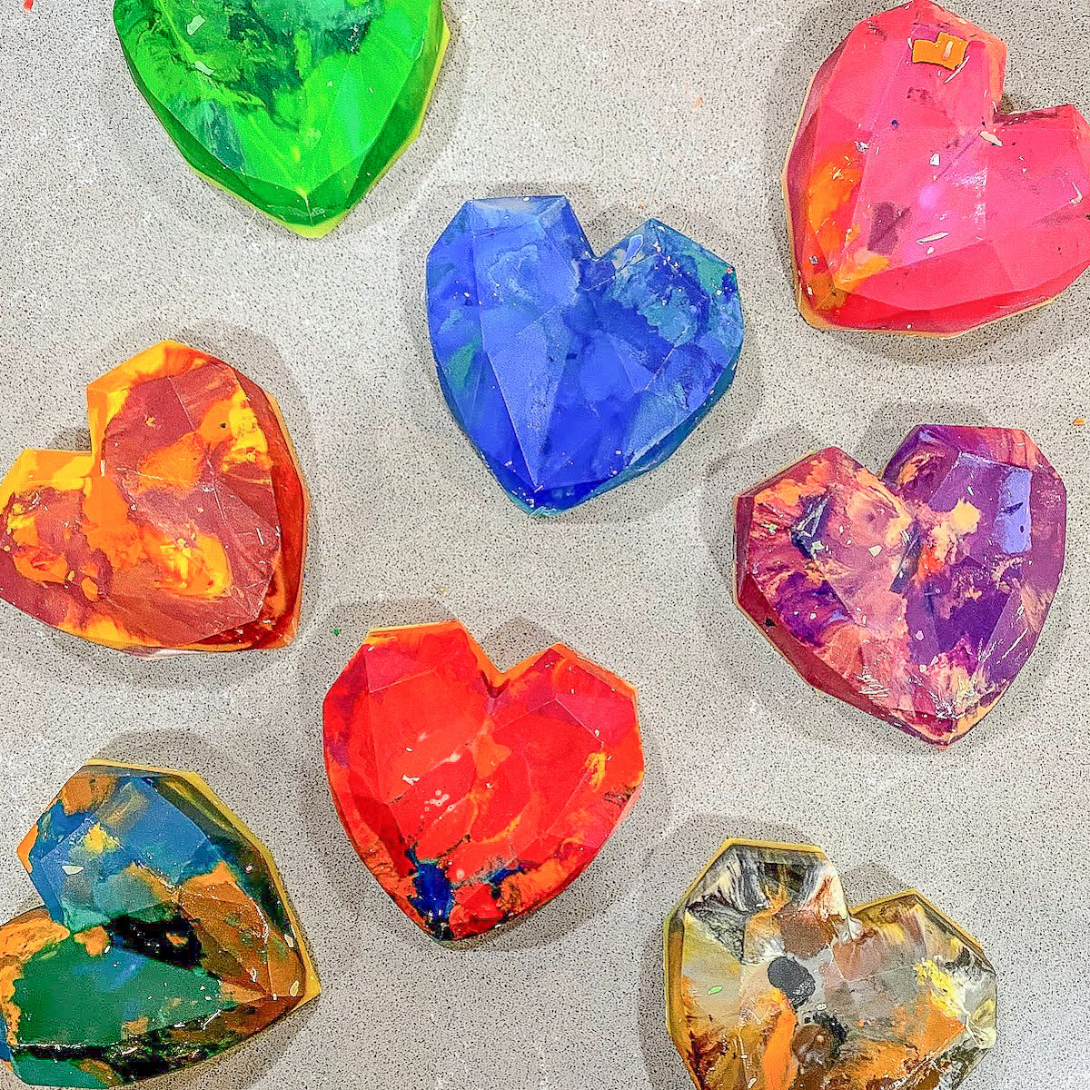 rainbow colored heart crayons on counter