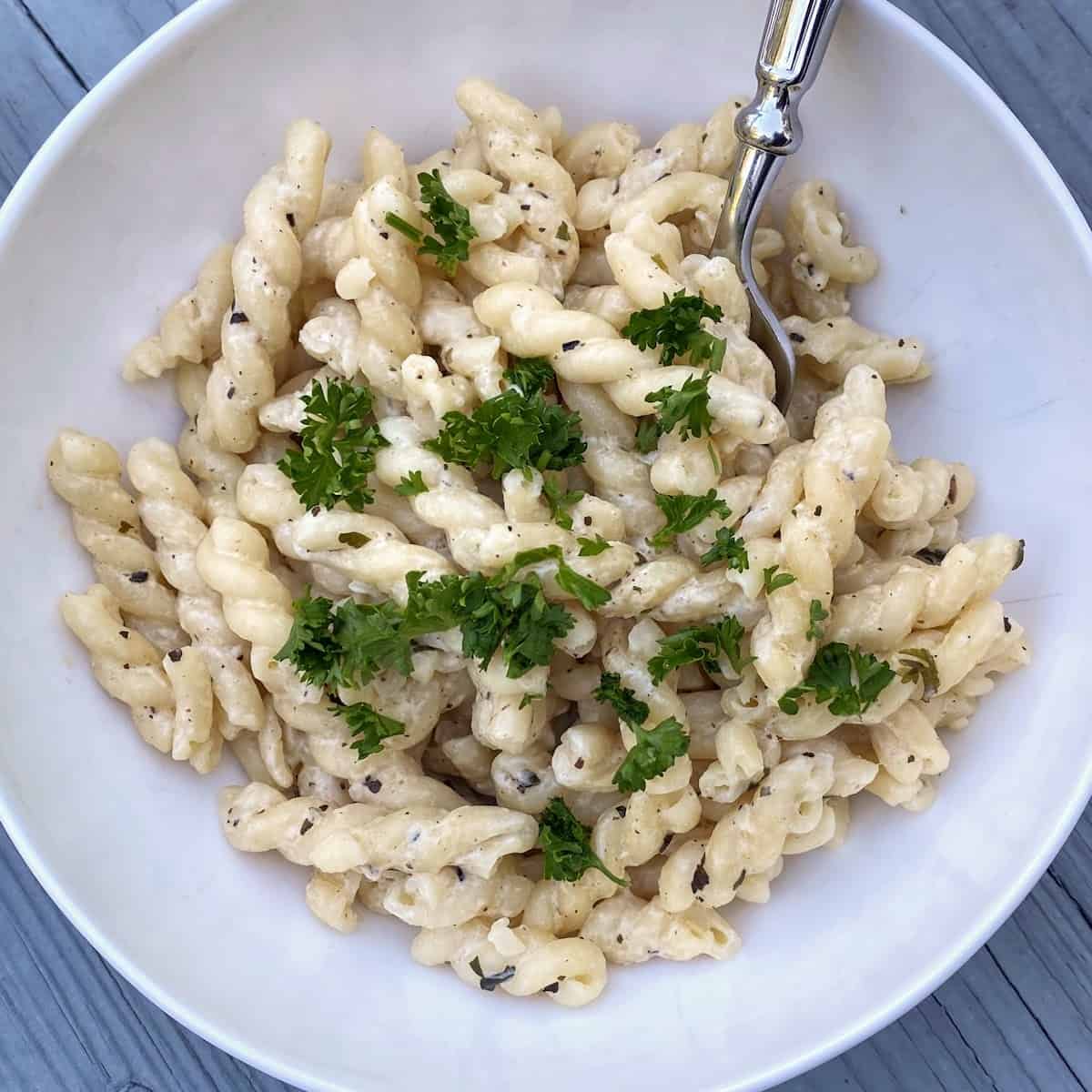 pasta in bowl with cream cheese sauce 