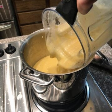 pouring potato leek soup back to pot