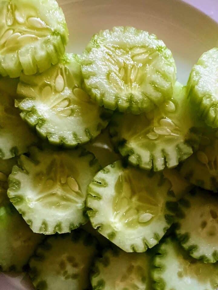 cucumbers sliced to look like flowers on a plate