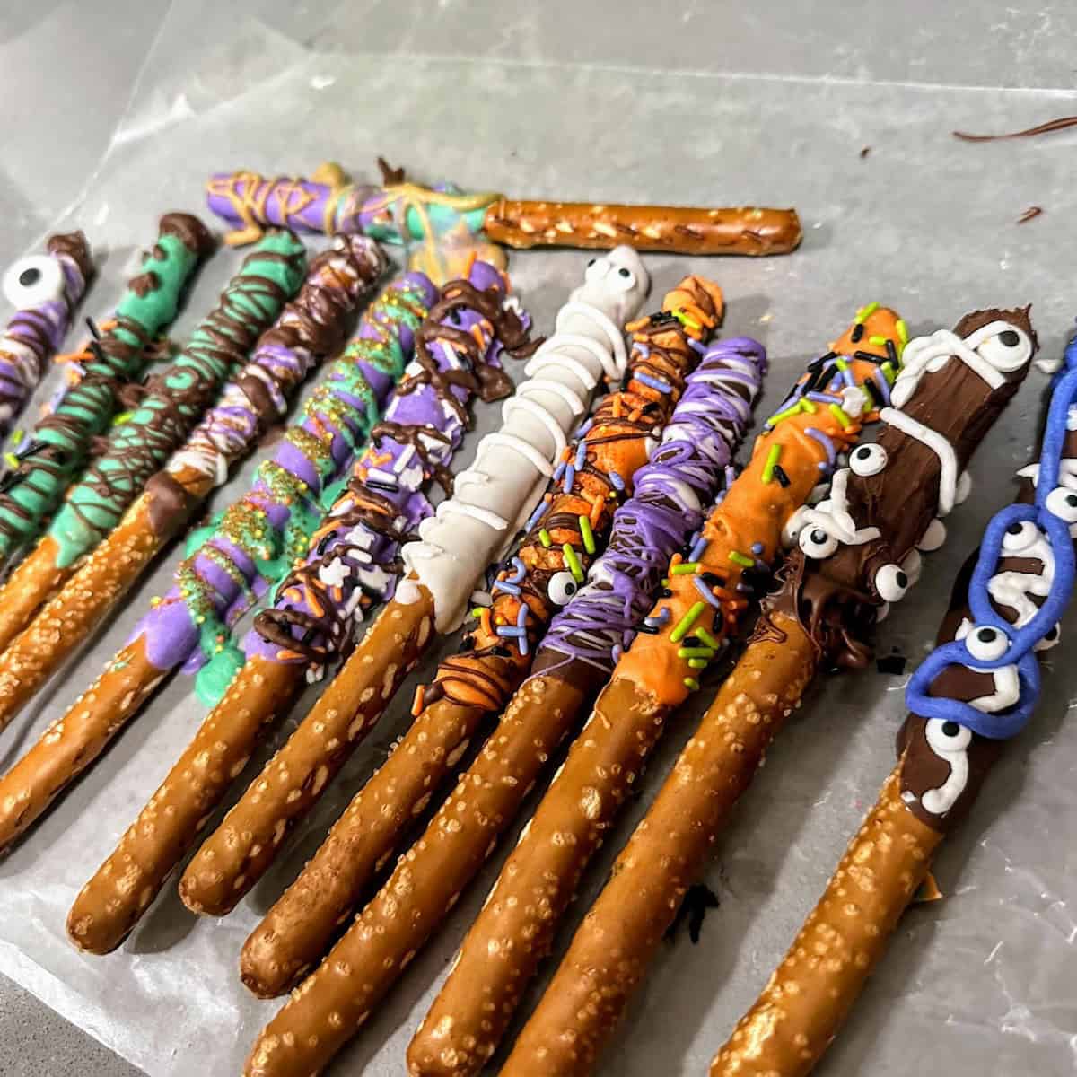 row of colorful Halloween candy dipped pretzels