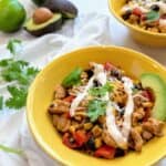 southwestern flavor chicken bowl with avocado, cilantro and veggies