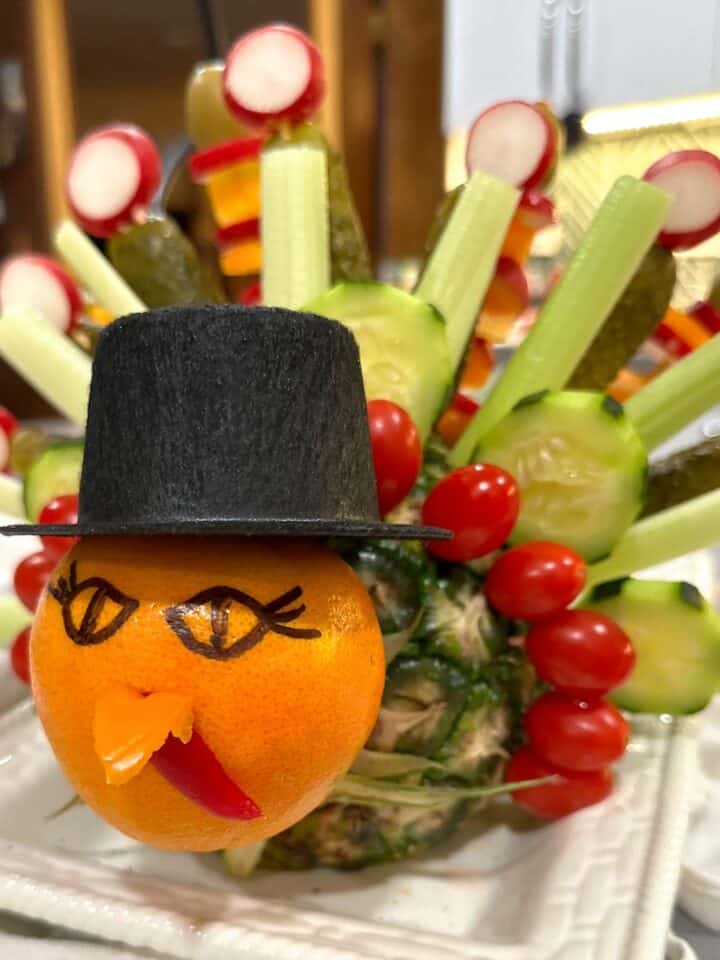 veggie turkey with orange, pineapple, veggies, and tiny hat