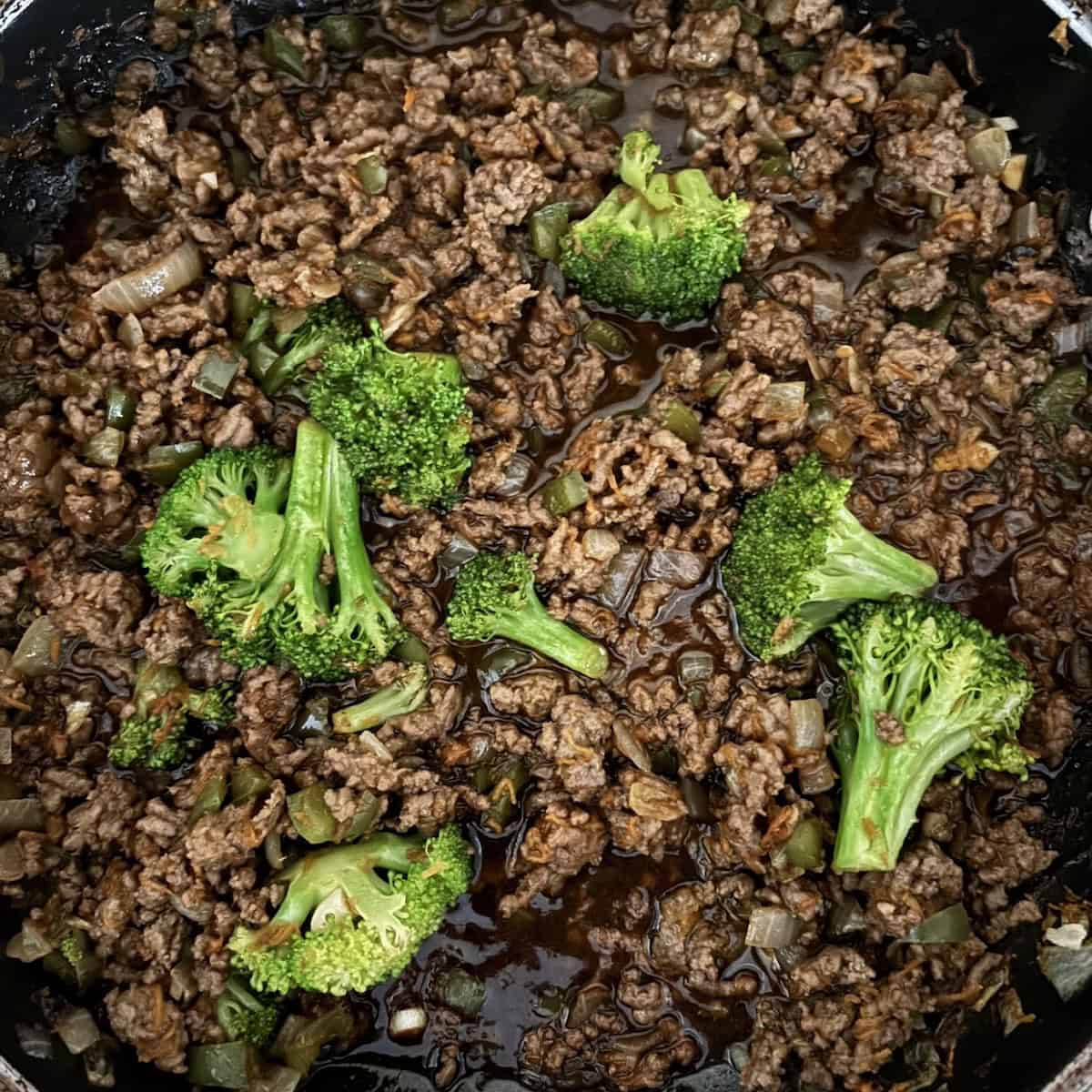 Beef and vegetables cooking in Teriyaki sauce for rice bowl.