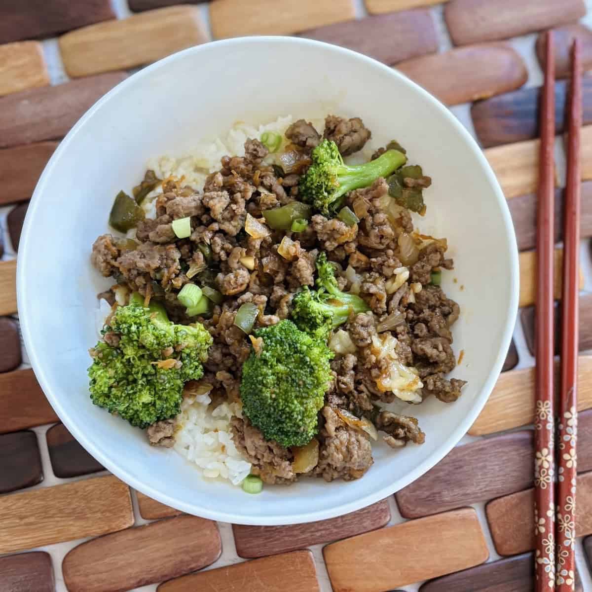 Teriyaki ice bowl in white bowl with side chop sticks.