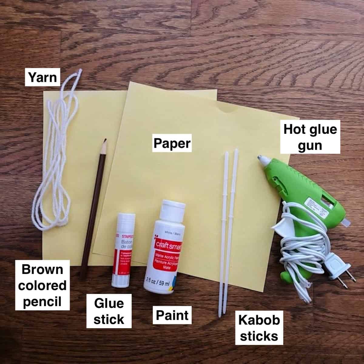Supplies for lemon paper fan craft.