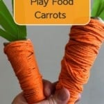 Two carrot crafts made from toilet paper rolls, orange yarn and green construction paper.
