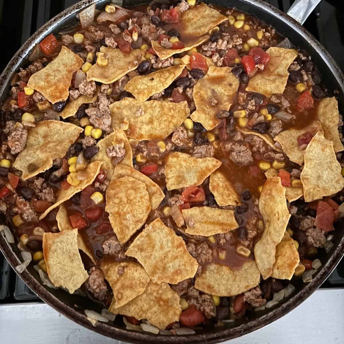 Enchilada skillet with ground turkey, veggies and tortilla strips.
