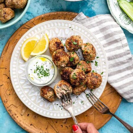 Family-friendly Greek meatballs on a white plate.