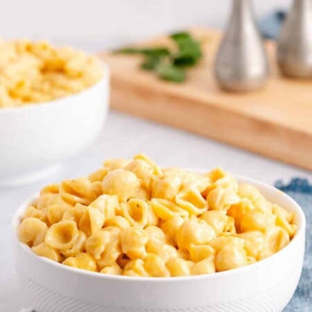 Creamy mac and cheese in a white bowl.